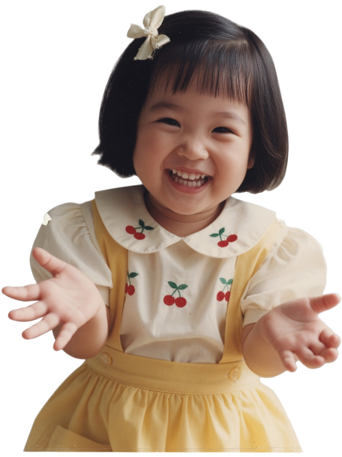 A little girl beaming with a big smile